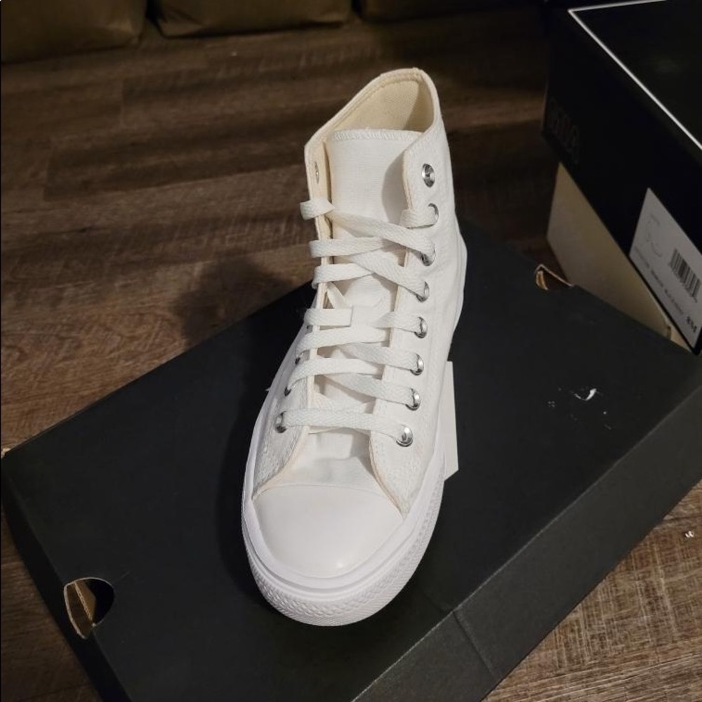 All white Converse High Top Platforms. In amazing condition. Size 8.